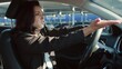 © Vlad - Young woman driving in new auto, business concept