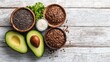 © Pannee - Fresh Avocado Slices with Various Seeds and Greens on Wooden Table Top