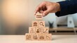 © SewcreamStudio - Financial planning, business strategy, investment growth, wealth management, financial icons, wooden blocks, businessman hand building a pyramid for professional money management.