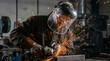 © Amity - Industrial worker wearing face shield with sparks from angle grinder metalworking