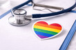 © praewpailyn - Lgbtq health clinic stethoscope rainbow heart healthcare support inclusive medical service colorful love symbol pride patient care compassion