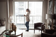 © peopleimages.com - Thinking, woman and window with coffee at house for vision, start day and calm morning. Thoughts, female person and reflection with warn beverage, daydreaming and nostalgia memory with outdoor view