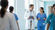 © tonstock - An expert doctor engages in healthcare collaboration and medicine through professional collaboration in a bright hallway.