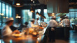 © Sabana - A bustling kitchen with chefs preparing food on a long counter in a modern restaurant