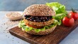 © Enver - quinoa and black bean veggie burger on whole grain bun with lettuce and tomato