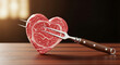 © Mirivox - Heart-shaped raw meat pierced by a fork, resting on a wooden surface, symbolizing culinary passion and love for food, especially meat dish