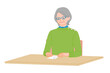 © mw - Senior woman checking postcard placed on desk