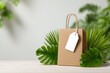 © vectorizer88 - Creative Shopping Bag with Blank Tag Surrounded by Lush Greenery