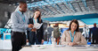 © Andrey Popov - Global Employment Fair: Diverse Booth Exhibitors