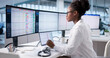© Andrey Popov - Black Businesswoman Managing Hospital Billing Using Computer Technology