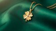 © Darmanto - Gold four leaf clover necklace pendant on soft green silk fabric luxury jewelry mockup