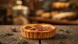 © VolumeThings - Close-up of a mini quiche featuring goat cheese and Andouillette sausage from Troyes, made in a French bakery