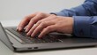 © Hannah - Hands typing on laptop keyboard