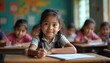 © Pete - Young asian girl smiles sitting at desk in classroom. Other kids learn at tables. Children study together in school. Focus on happy girl with braids. Education in Asia.