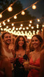© Pete - Group of smiling friends enjoying drinks at an outdoor evening party. String lights glow above as people socialize and celebrate. This lively event fosters connection and good times.