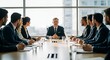 © Dave Dean - Confident business leader presenting to diverse team in modern office