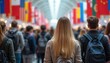 © Maryna - International education fair with students exploring global study options. Flags represent countries. People gather to learn about universities and programs for future careers.
