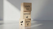 © Md Hifjul - Three wooden blocks stacked vertically with learn improve and grow text and nature icons on reflective white surface