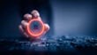 © kaliel - Hand presenting glowing microchip symbol representing secure access authentication and cybersecurity technology.