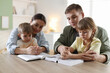 © New Africa - Family with Bible praying together at wooden table indoors