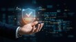 © AspctStyle - Businessman hand holding holographic compliance certified shield icon floating above a dark digital network background with copy space for regulatory and governance concept.