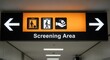 © Dinda - Directional Sign Illuminates Screening Area Guidance at Airport Transportation Facility