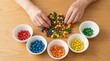 © Sugar Love Love - Senior hands sorting colorful wooden beads for dementia therapy