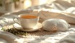 © Andy Cinematography - FlyPro Firefly's soft cotton eye mask and herbal tea blend, served in a delicate porcelain cup on a linen placemat, captured in detail.