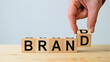 © Artby-Mahadi - Fostering brand vitality and arranging wooden blocks to establish a strong business identity and market presence