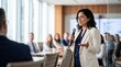 © ryker - Confident latina senior woman speaking into microphone at corporate meeting, professional presentation and engaged audience in modern glass conference room