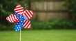 © Hussain - Happy labor day celebration with patriotic pinwheel on green lawn