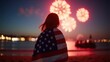 © Mystery - Woman watching fireworks wrapped in american flag, evening sky with colorful sunset and bokeh city lights in background, concept of independence day, patriotic holidays