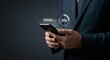 © lianlian liang - Businessman holding smartphone with holographic system update progress bar at twenty five percent loading for tech upgrade software installation and refresh