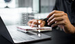 © Father_Studio - Businessman reviewed procedures and processes through a virtual online document with checkboxes, reviewing compliance with company policies, regulations, and terms and conditions.
