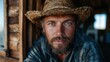 © senadlife - A rugged farmer gazes intently at the camera, showcasing determination and a deep connection to nature, framed by rustic wooden elements that speak of a hard-working lifestyle.