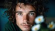 © senadlife - A close-up portrait of a young man with expressive eyes, surrounded by soft floral elements, showcasing a moment of introspection and artistic depth.