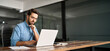 © insta_photos - Busy professional business man company employee, young male programmer, latin businessman looking at computer thinking on online investment or software development using laptop working at office.