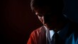 © Bussakon - Dramatic portrait of a man in profile bathed in red and blue light contemplating intensely under dramatic studio lighting
