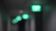 © Blurred Bokeh - Abstract Green Bokeh Lights in Dark Corridor