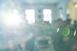 © elenavolf - Abstract sunlight and lens flare in blurred interior room setting with bokeh effect.