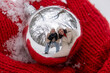 © phpetrunina14 - Reflective Ornament Captures Couple's Winter Selfie.
