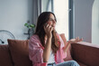 © Daniel - Happy woman blab on smartphone, lead pleasant personal conversation rest on couch, smile, share news with family use mobile connection and modern gadget. Remote talk, pastime at home, communication