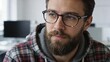 © happy - Man with beard and glasses in plaid hoodie