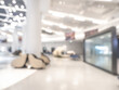 © tete_escape - Blurred background of modern design hall of mall interior with bright lights and open space, perfect for retail, business, lifestyle, marketing, and commercial design concepts. Soft focus effect.