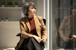 © Fahng - Mature senior business woman at work looking away dreaming of future successful career. lost in thoughts visualizing, business vision concept.