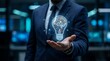 © Asiyah12 - Businessman Holding Holographic Light Bulb in Futuristic Technology Setting