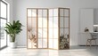 © Cetak - Room interior with a folding screen, large plant, and minimalist design