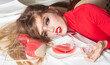 © Volodymyr - Woman luxury portrait with red dress emotion. Woman glamorous lifestyle with wine glass mood. Woman fashion beauty with dramatic makeup style. Woman elegant concept with sensual expression.