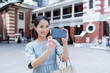 © leungchopan - Travel woman take photo with cellphone Hong Kong