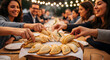 © BackgroundStudio - Group of friends sharing traditional Argentine empanadas at an o